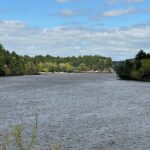 Wisconsin River and tree-lined banks viewed from the Wisconsin Dells Scenic River Walk.